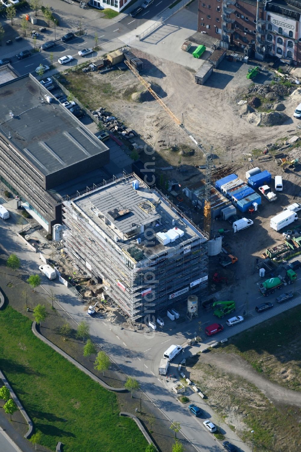 Bremen from above - Construction site to build a new office and commercial building in the development area of Ueberseestadt in Bremen, Germany