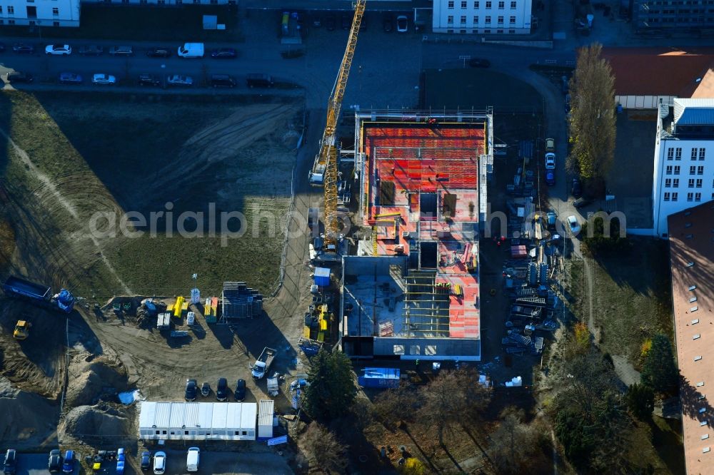 Berlin from the bird's eye view: Construction site to build a new office and commercial building on Ernst-Augustin-Strasse in the district Adlershof in Berlin, Germany