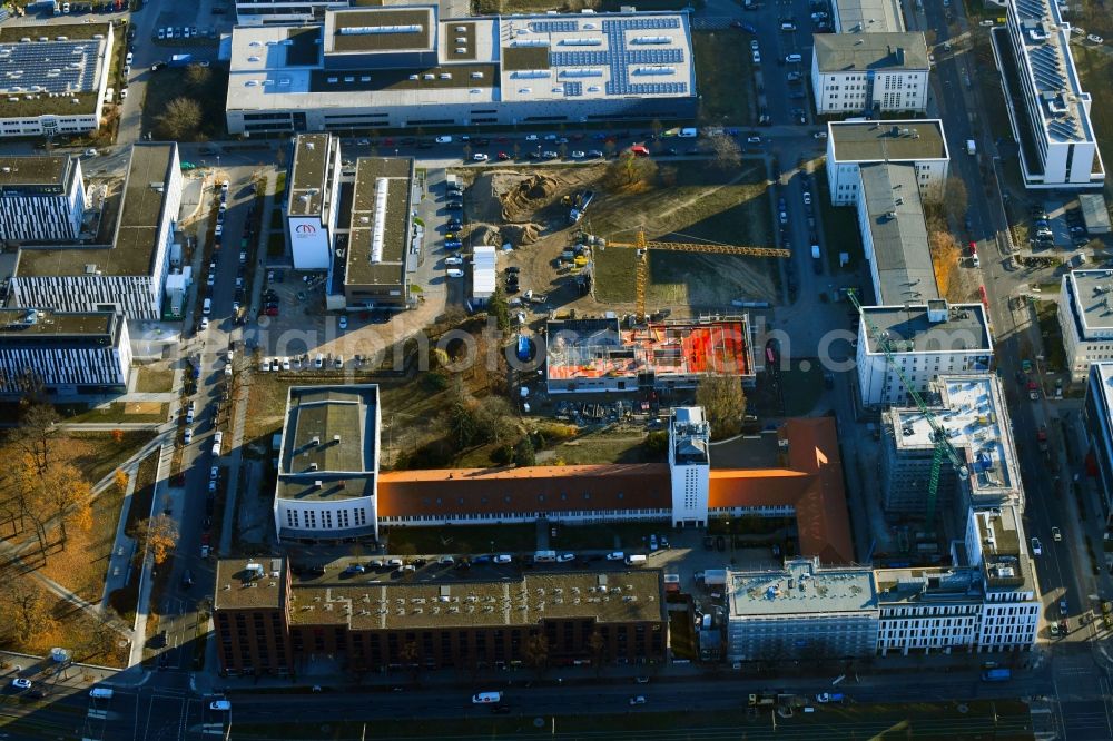 Aerial image Berlin - Construction site to build a new office and commercial building on Ernst-Augustin-Strasse in the district Adlershof in Berlin, Germany