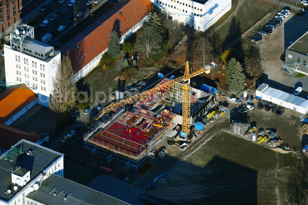 Berlin from above - Construction site to build a new office and commercial building on Ernst-Augustin-Strasse in the district Adlershof in Berlin, Germany