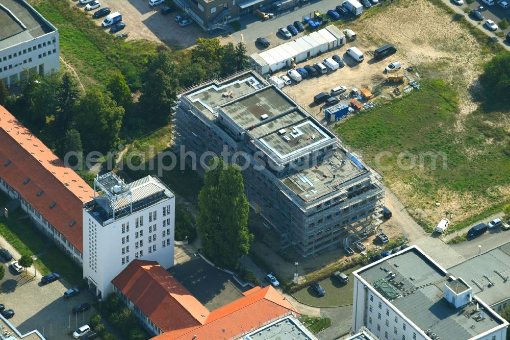 Aerial photograph Berlin - Construction site to build a new office and commercial building on Ernst-Augustin-Strasse in the district Adlershof in Berlin, Germany