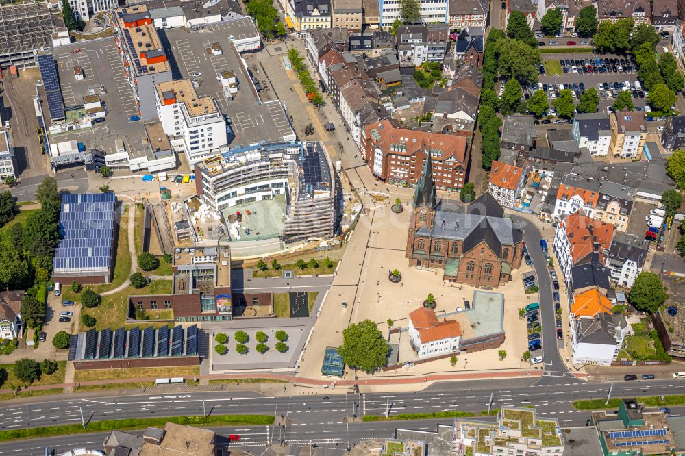 Herne from the bird's eye view: Construction site for the new construction of an office and commercial building Europagarten overlooking the church Kreuzkirche at Europaplatz in Herne at Ruhrgebiet in the state North Rhine-Westphalia, Germany