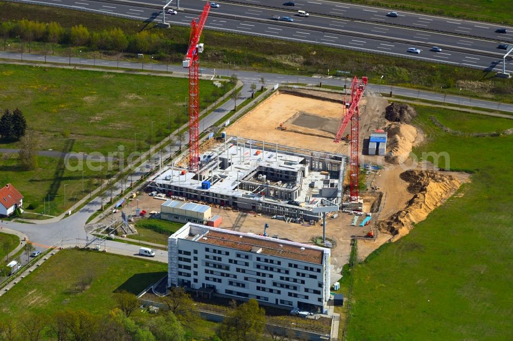 Schönefeld from above - Construction site to build a new office and commercial building FLEXGATE on Kienberger Allee Ecke Am Flughafen in Schoenefeld in the state Brandenburg, Germany