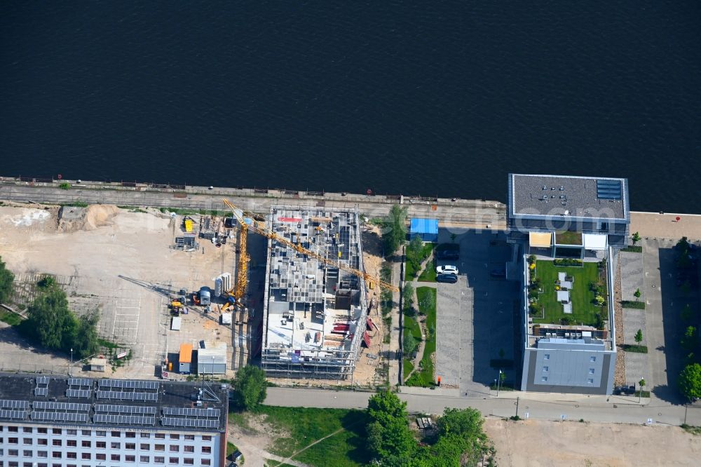 Aerial photograph Rostock - Construction site to build a new office and commercial building at Neptun Kai on Kurt-Dunkelmann-Strasse in Rostock in the state Mecklenburg - Western Pomerania, Germany