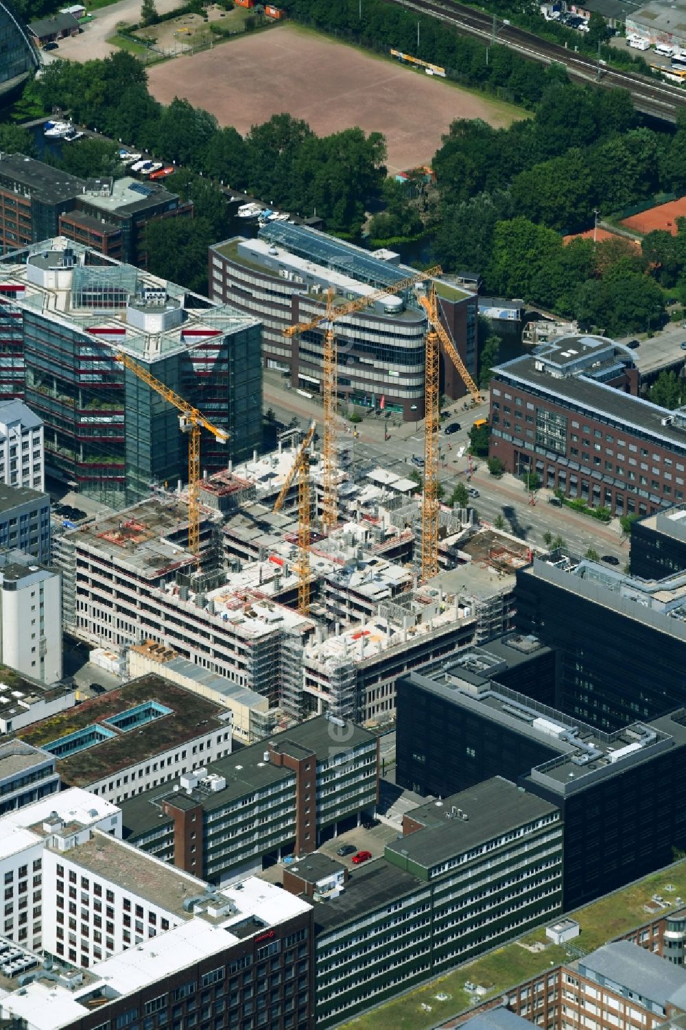 Hamburg from the bird's eye view: Construction site to build a new office and commercial building of Olympus Campus on Heidenkonpsweg - Wendenstrasse in Hamburg, Germany