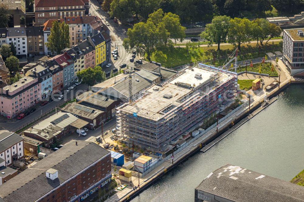 Dortmund from the bird's eye view: Construction site to build a new office and commercial building on street Speicherstrasse - Hafenpromenade in the district Hafen in Dortmund at Ruhrgebiet in the state North Rhine-Westphalia, Germany