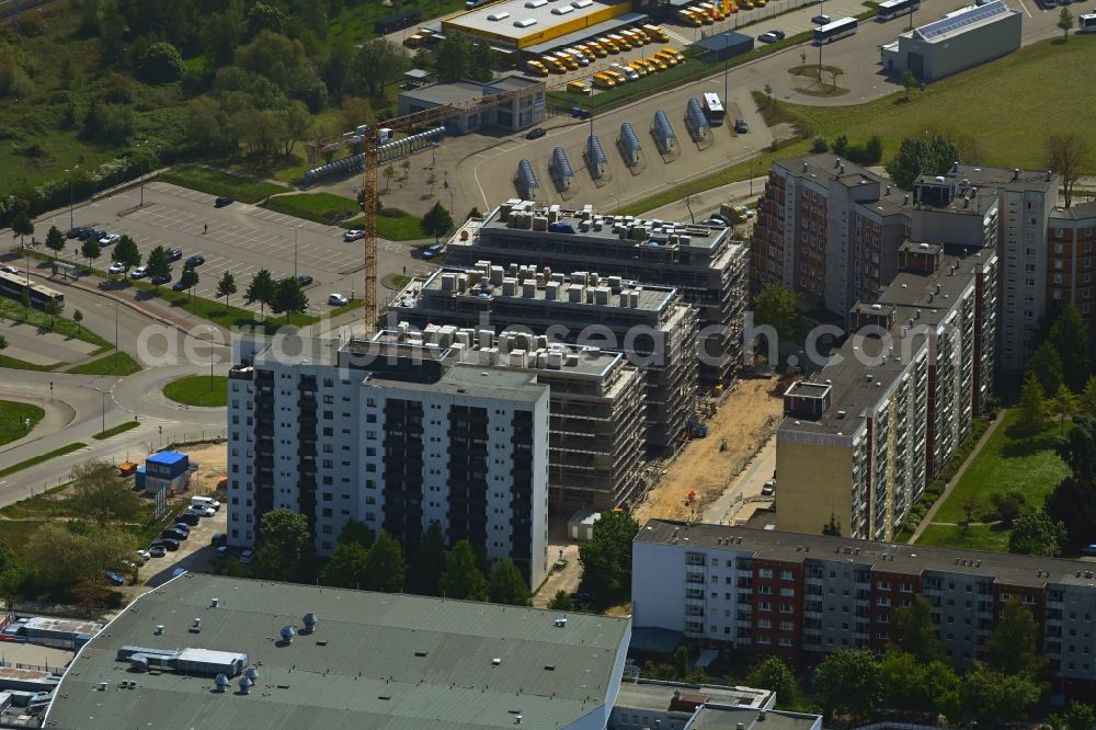 Rostock from the bird's eye view: Construction site to build a new office and commercial building on Bahnhofsvorplatz in the district Suedstadt in Rostock in the state Mecklenburg - Western Pomerania, Germany