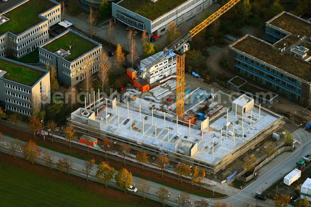 München from the bird's eye view: Construction site to build a new office and commercial building on street Paul-Wassermann-Strasse - Am Huellgraben in the district Trudering-Riem in Munich in the state Bavaria, Germany