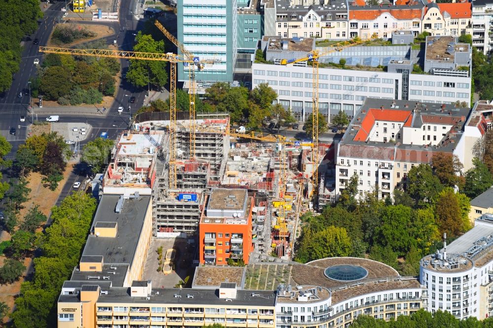 Berlin from the bird's eye view: Construction site to build a new office and commercial building Quartier Bundesallee on Bundesallee corner Nachodstrasse in Berlin, Germany