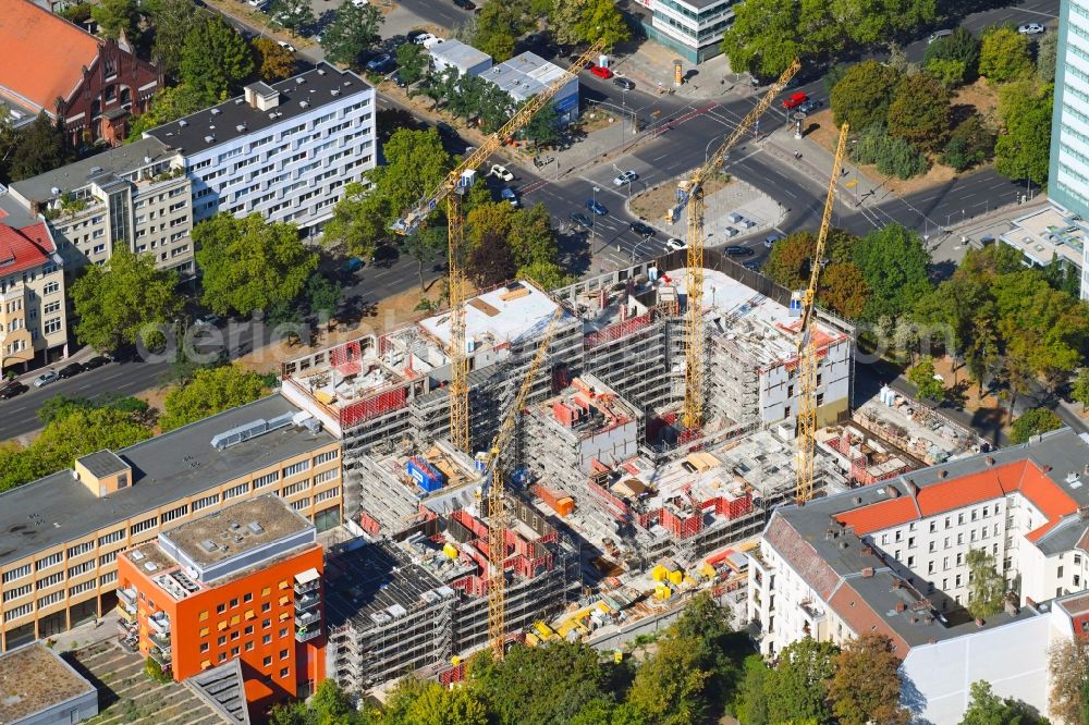 Berlin from the bird's eye view: Construction site to build a new office and commercial building Quartier Bundesallee on Bundesallee corner Nachodstrasse in Berlin, Germany