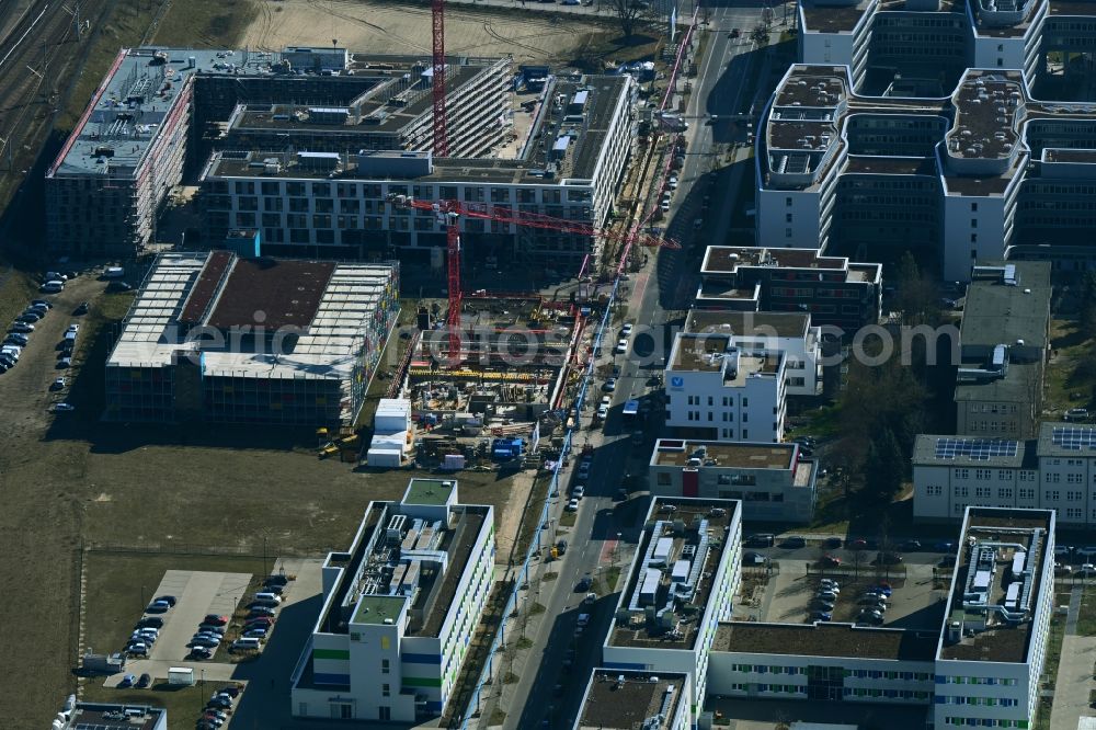 Berlin from the bird's eye view: Construction site to build a new office and commercial building of Scienion AG on Wagner-Regeny-Strasse in the district Adlershof in Berlin, Germany