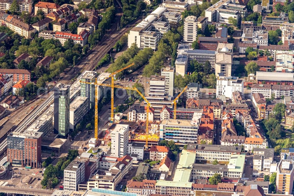 Aerial photograph Freiburg im Breisgau - Construction site to build a new office and commercial building of Volksbank Freiburg and the assembly hall of St. Ursula grammar school on Bismarckallee - Eisenbahnstrasse in Freiburg im Breisgau in the state Baden-Wurttemberg, Germany