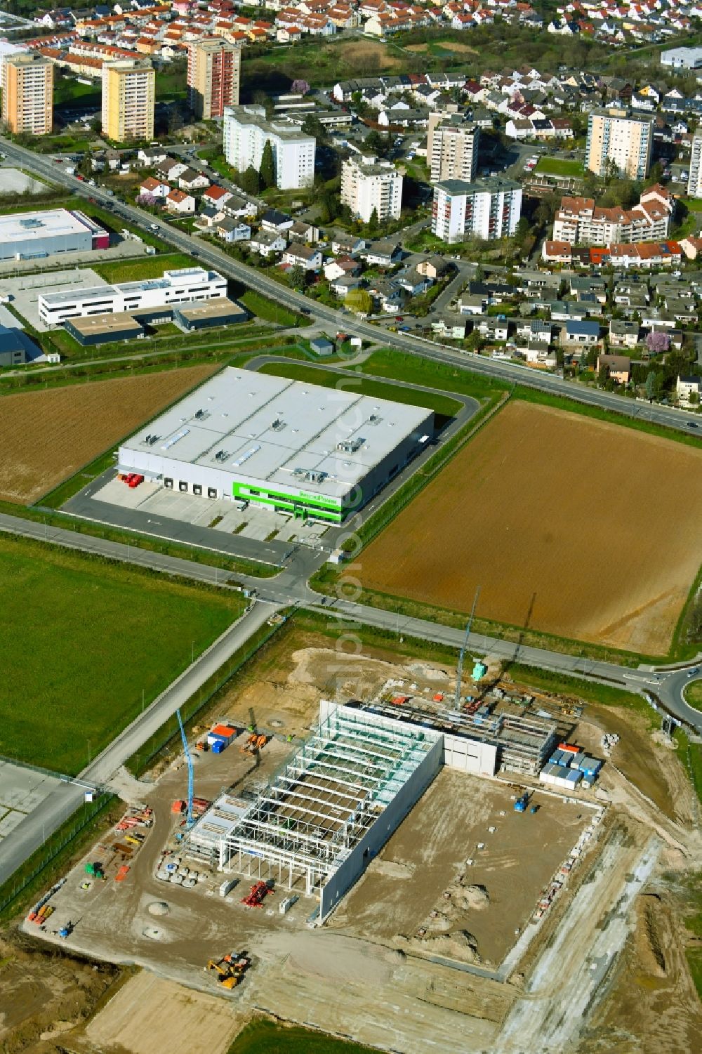 Heppenheim (Bergstraße) from the bird's eye view: Construction site for the construction of an office and commercial building for the new company headquarters and customer center of WILHELM SCHAeFER GMBH on Lise-Meitner-Strasse in Heppenheim (Bergstrasse) in the state of Hesse, Germany