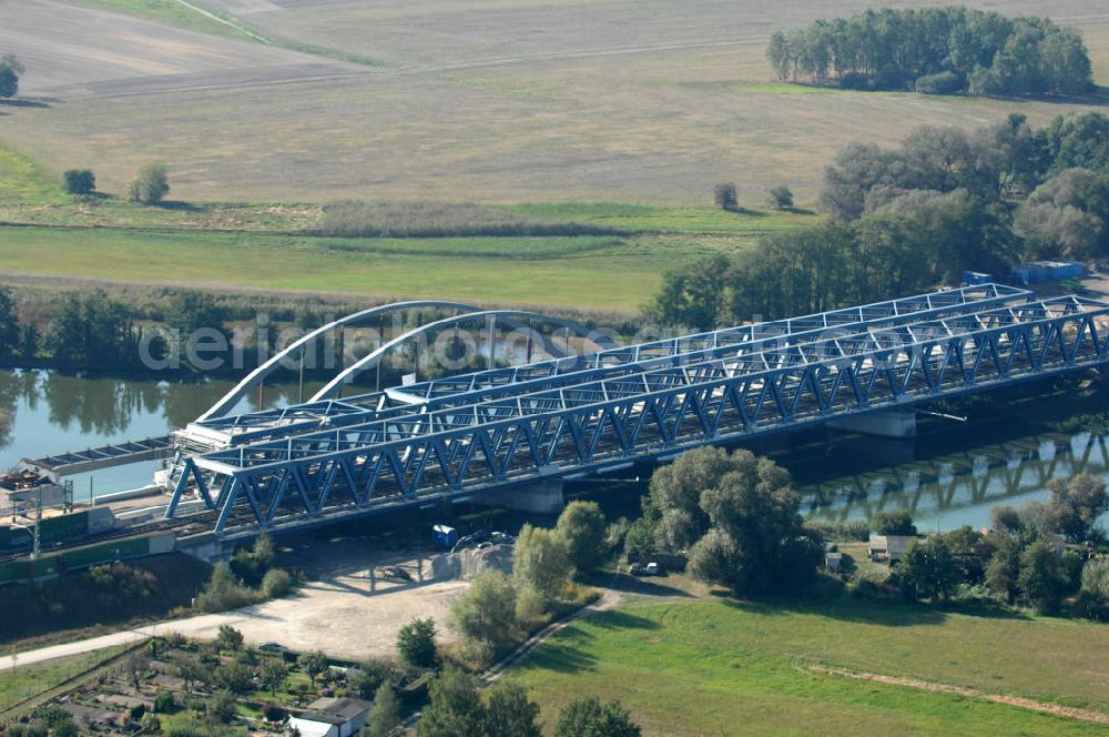 RATHENOW from the bird's eye view: Blick auf die Arbeiten zum Neubau der Eisenbahnüberführung Havelbrücke Rathenow. In einer 1. Phase wurde die bestehende Brücke zurückgebaut, um Baufreiheit für die Ortsumfahrung B 188 Rathenow zu schaffen. Anschließend wird die dafür notwendige Straßenüberführung an gleicher Stelle errichtet. Die neue Havelbrücke für den Zugverkehr wird in veränderter Lage erbaut. Bis zum Dezember 2009 werden die Brückenbauarbeiten andauern. Projektsteuerung SCHÜßLERPLAN-Ingenieurgesellschaft