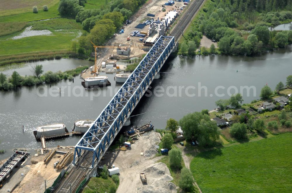 RATHENOW from the bird's eye view: Blick auf die Arbeiten zum Neubau der Eisenbahnüberführung Havelbrücke Rathenow. In einer 1. Phase wurde die bestehende Brücke zurückgebaut, um Baufreiheit für die Ortsumfahrung B 188 Rathenow zu schaffen. Anschließend wird die dafür notwendige Straßenüberführung an gleicher Stelle errichtet. Die neue Havelbrücke für den Zugverkehr wird in veränderter Lage erbaut. Bis zum Dezember 2009 werden die Brückenbauarbeiten andauern. Projektsteuerung SCHÜßLERPLAN-Ingenieurgesellschaft