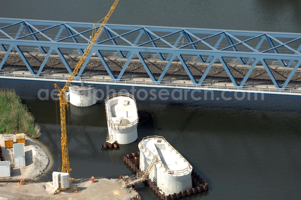 RATHENOW from the bird's eye view: Blick auf die Arbeiten zum Neubau der Eisenbahnüberführung Havelbrücke Rathenow. In einer 1. Phase wurde die bestehende Brücke zurückgebaut, um Baufreiheit für die Ortsumfahrung B 188 Rathenow zu schaffen. Anschließend wird die dafür notwendige Straßenüberführung an gleicher Stelle errichtet. Die neue Havelbrücke für den Zugverkehr wird in veränderter Lage erbaut. Bis zum Dezember 2009 werden die Brückenbauarbeiten andauern. Projektsteuerung SCHÜßLERPLAN-Ingenieurgesellschaft