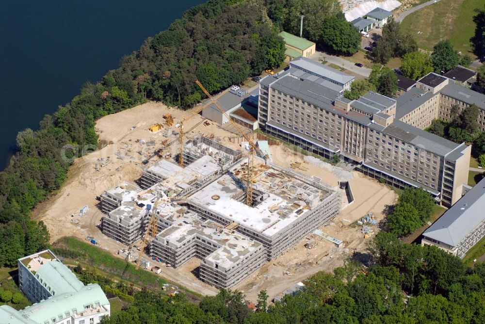 Aerial photograph Rüdersdorf - Blick auf die Baustelle des Krankenhaus Neubaus des Evangelisch-Freikirchlichen Krankenhaus Rüdersdorf. Im Hintergrund das alte Bettenhaus mit sämtlichen Nebengebäuden aus den 60er-Jahren, welches nach dem Umzug in das neue Gebäude abgerissen wird. Auf dem Gelände wird dann der Park des Krankenhauses entstehen, u. a. mit einem Kinderspielplatz und Medizinalkräutergarten. Das neue drei- und viergeschossige Krankenhaus hat eine Kapazität für 287 Betten in 135 Patientenzimmern. Kontakt: Krankenhaus und Poliklinik Rüdersdorf GmbH, Seebad 82/83, 15562 Rüdersdorf, Tel. +49(0)33638 83 0, Fax +49(0)33638 83 228, E-Mail: info @krankenhaus-ruedersdorf.de; Kontakt: Immanuel Diakonie GmbH (Holding), Am Kleinen Wannsee 5, 14109 Berlin, Tel. +490)30 80505 272, Fax +490)30 80505 266, E-Mail: mail@immanuel.de