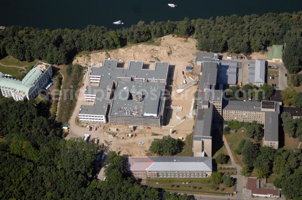 Aerial image Rüdersdorf - Blick auf die Baustelle des Krankenhaus Neubaus des Evangelisch-Freikirchlichen Krankenhaus Rüdersdorf. Rechts daneben steht das alte Bettenhaus mit sämtlichen Nebengebäuden aus den 60er-Jahren, welches nach dem Umzug in das neue Gebäude abgerissen wird. Auf dem Gelände wird dann der Park des Krankenhauses entstehen, u. a. mit einem Kinderspielplatz und Medizinalkräutergarten. Das neue drei- und viergeschossige Krankenhaus hat eine Kapazität für 287 Betten in 135 Patientenzimmern. Kontakt: Krankenhaus und Poliklinik Rüdersdorf GmbH, Seebad 82/83, 15562 Rüdersdorf, Tel. +49(0)33638 83 0, Fax +49(0)33638 83 228, E-Mail: info @krankenhaus-ruedersdorf.de; Kontakt: Immanuel Diakonie GmbH (Holding), Am Kleinen Wannsee 5, 14109 Berlin, Tel. +490)30 80505 272, Fax +490)30 80505 266, E-Mail: mail@immanuel.de