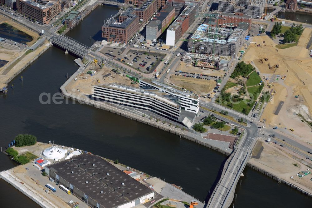 Hamburg from the bird's eye view: View of building lot of the new Hafen city University in Hamburg. The building will be constructed on behalf of the Ministry of Science and Research of Hamburg by the company Riedel Bau for the subjects architecture, civil engineering, geomatics and municipal planning