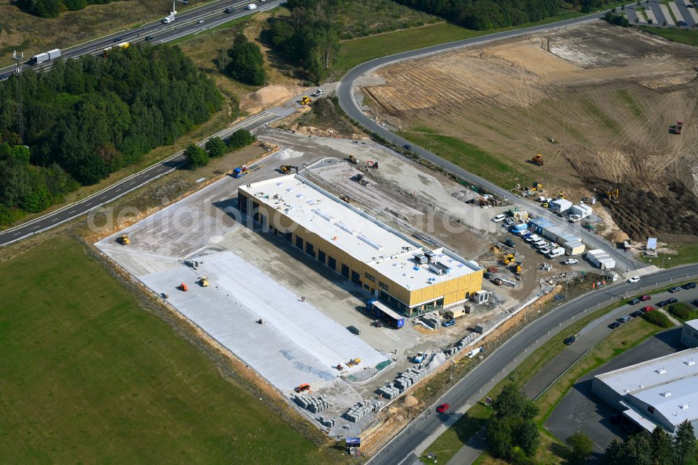 Aerial image Leppersdorf - Construction site for the new building complex and site of the truck repair workshop of Daimler Truck - FTA GmbH on the street An den Breiten in Leppersdorf in the state of Saxony, Germany