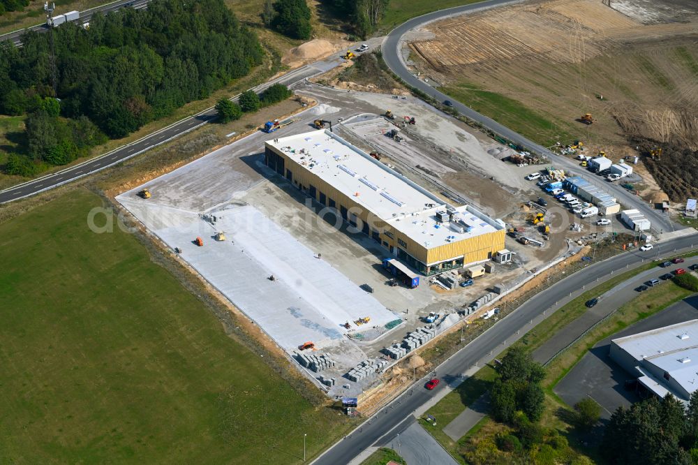 Aerial photograph Leppersdorf - Construction site for the new building complex and site of the truck repair workshop of Daimler Truck - FTA GmbH on the street An den Breiten in Leppersdorf in the state of Saxony, Germany