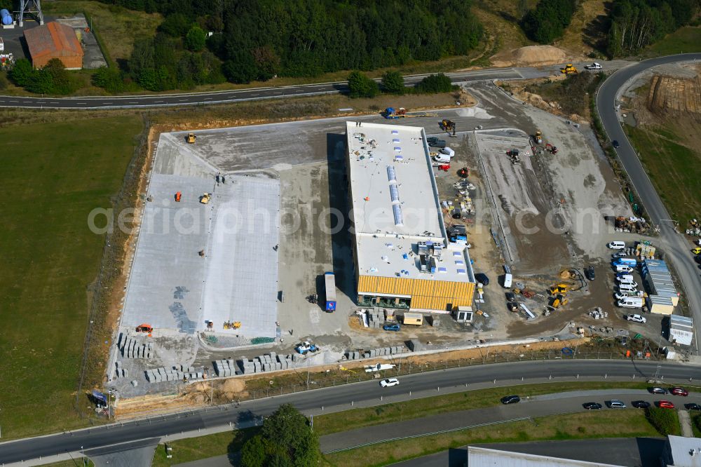 Leppersdorf from above - Construction site for the new building complex and site of the truck repair workshop of Daimler Truck - FTA GmbH on the street An den Breiten in Leppersdorf in the state of Saxony, Germany