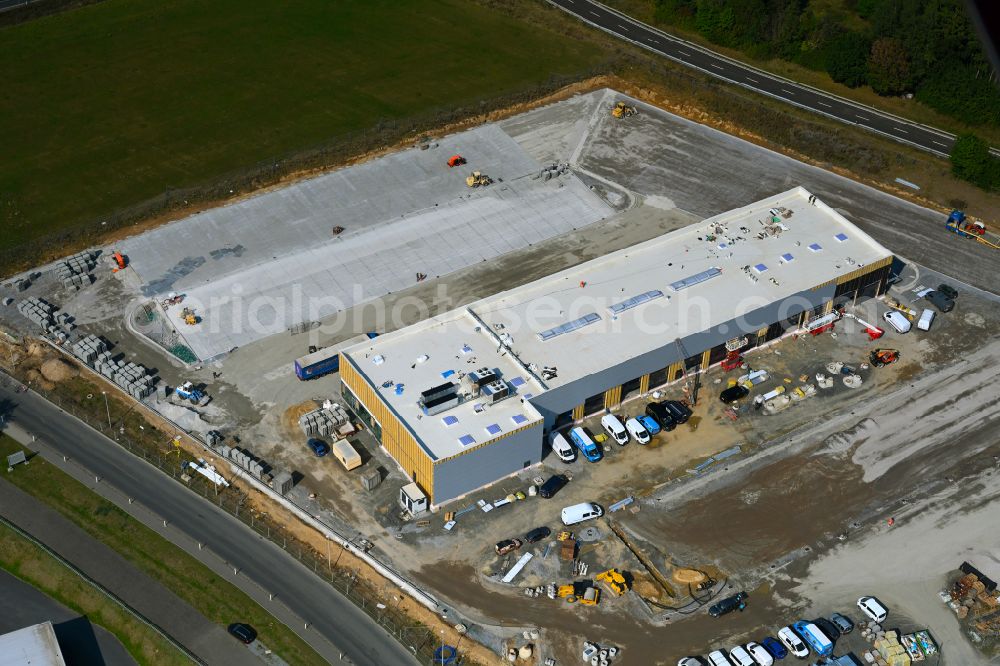 Leppersdorf from the bird's eye view: Construction site for the new building complex and site of the truck repair workshop of Daimler Truck - FTA GmbH on the street An den Breiten in Leppersdorf in the state of Saxony, Germany