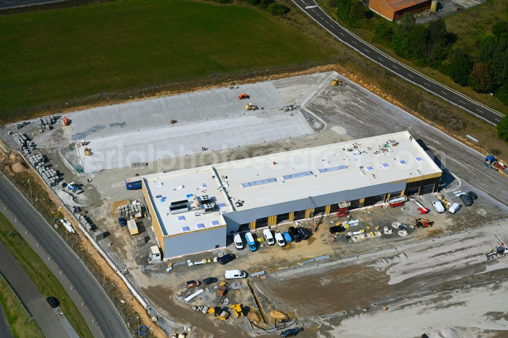 Aerial image Leppersdorf - Construction site for the new building complex and site of the truck repair workshop of Daimler Truck - FTA GmbH on the street An den Breiten in Leppersdorf in the state of Saxony, Germany