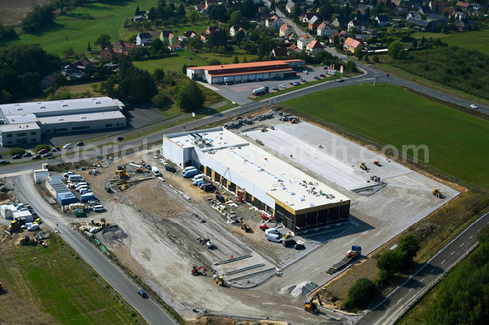 Leppersdorf from above - Construction site for the new building complex and site of the truck repair workshop of Daimler Truck - FTA GmbH on the street An den Breiten in Leppersdorf in the state of Saxony, Germany