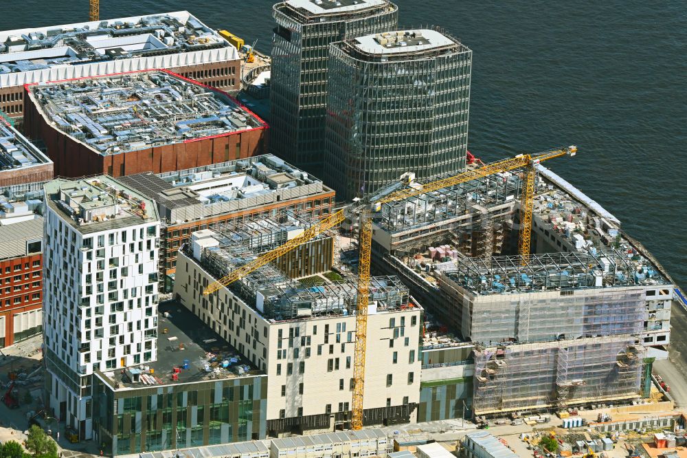 Aerial photograph Hamburg - Construction site for the new building complex of the shopping center at Ueberseequartier at Strandkai in the Hafencity district in Hamburg, Germany