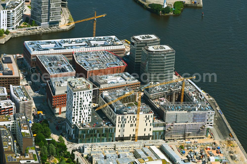 Hamburg from above - Construction site for the new building complex of the shopping center at Ueberseequartier at Strandkai in the Hafencity district in Hamburg, Germany