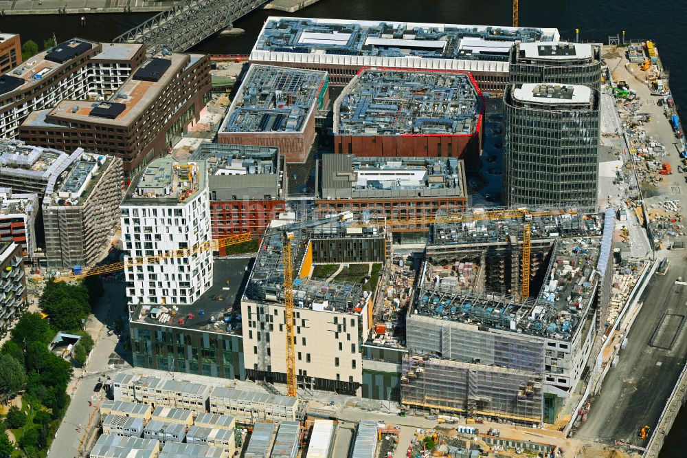 Hamburg from the bird's eye view: Construction site for the new building complex of the shopping center at Ueberseequartier at Strandkai in the Hafencity district in Hamburg, Germany