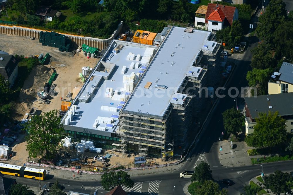 Aerial photograph Berlin - New construction of the building complex of the LIDL - shopping center on street Giesestrasse corner Hoenoer Strasse in the district Mahlsdorf in Berlin, Germany