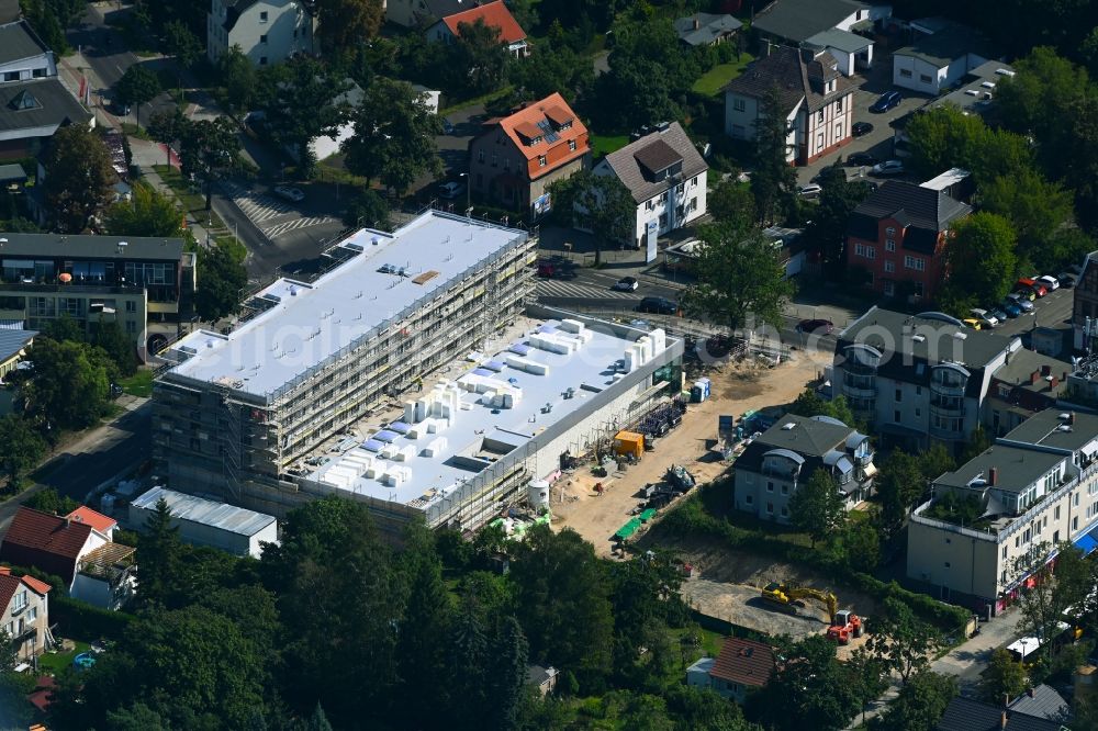 Berlin from the bird's eye view: New construction of the building complex of the LIDL - shopping center on street Giesestrasse corner Hoenoer Strasse in the district Mahlsdorf in Berlin, Germany