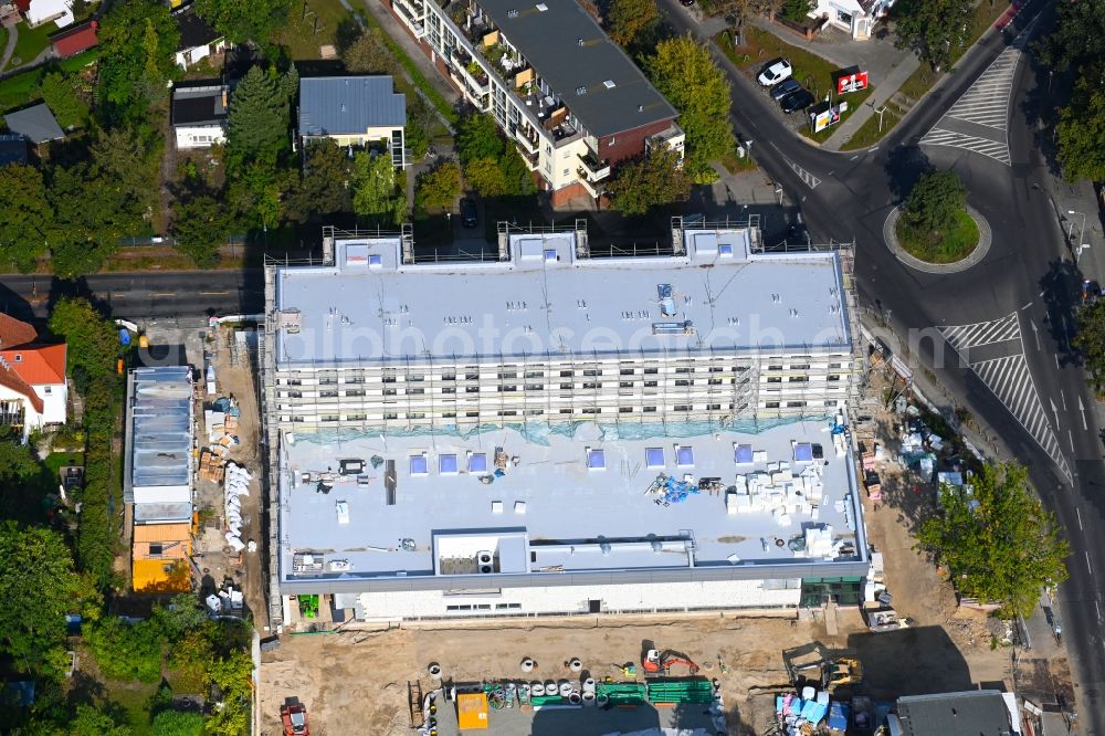 Aerial photograph Berlin - New construction of the building complex of the LIDL - shopping center on street Giesestrasse corner Hoenoer Strasse in the district Mahlsdorf in Berlin, Germany