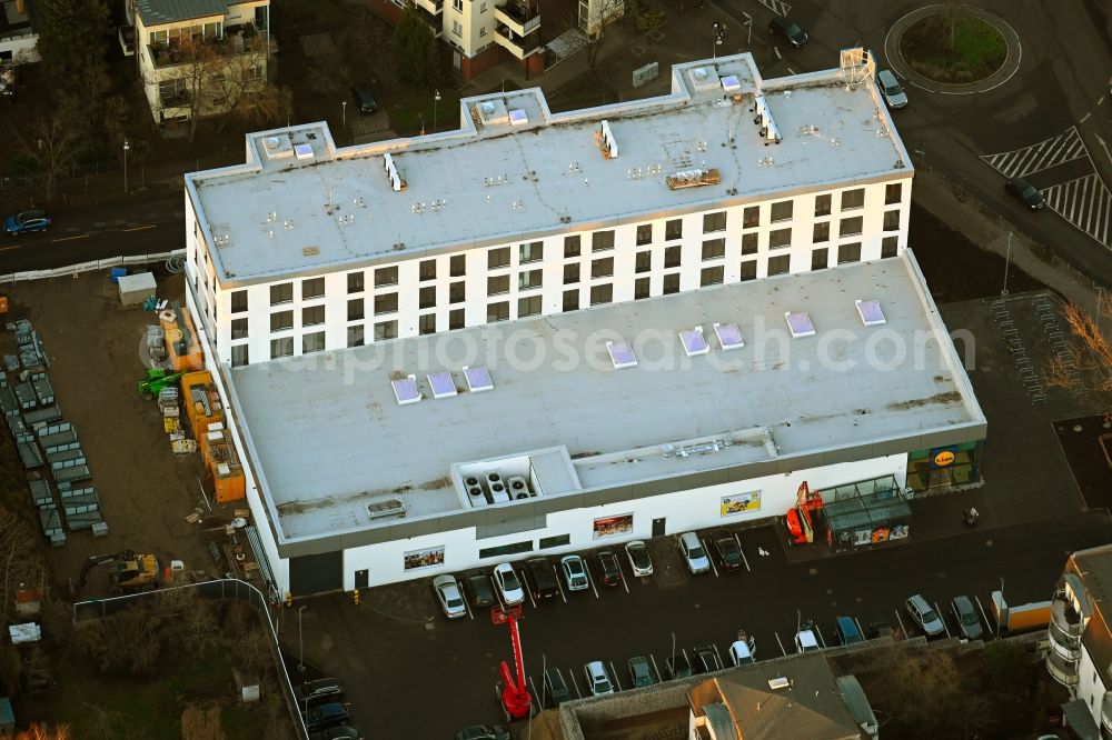 Aerial photograph Berlin - new construction of the building complex of the LIDL - shopping center on street Giesestrasse corner Hoenoer Strasse in the district Mahlsdorf in Berlin, Germany