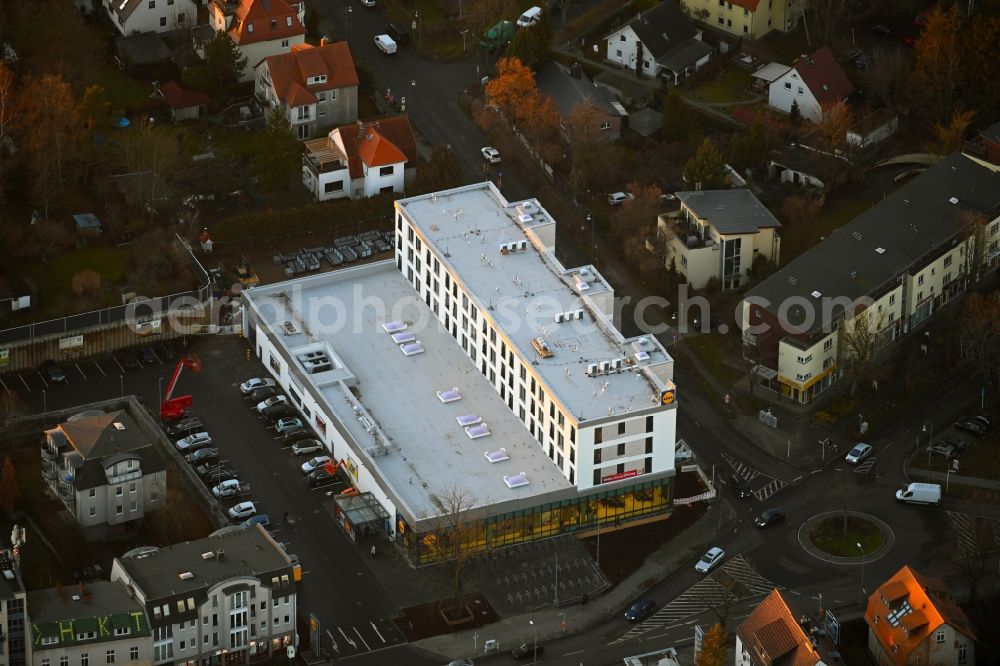 Aerial image Berlin - new construction of the building complex of the LIDL - shopping center on street Giesestrasse corner Hoenoer Strasse in the district Mahlsdorf in Berlin, Germany