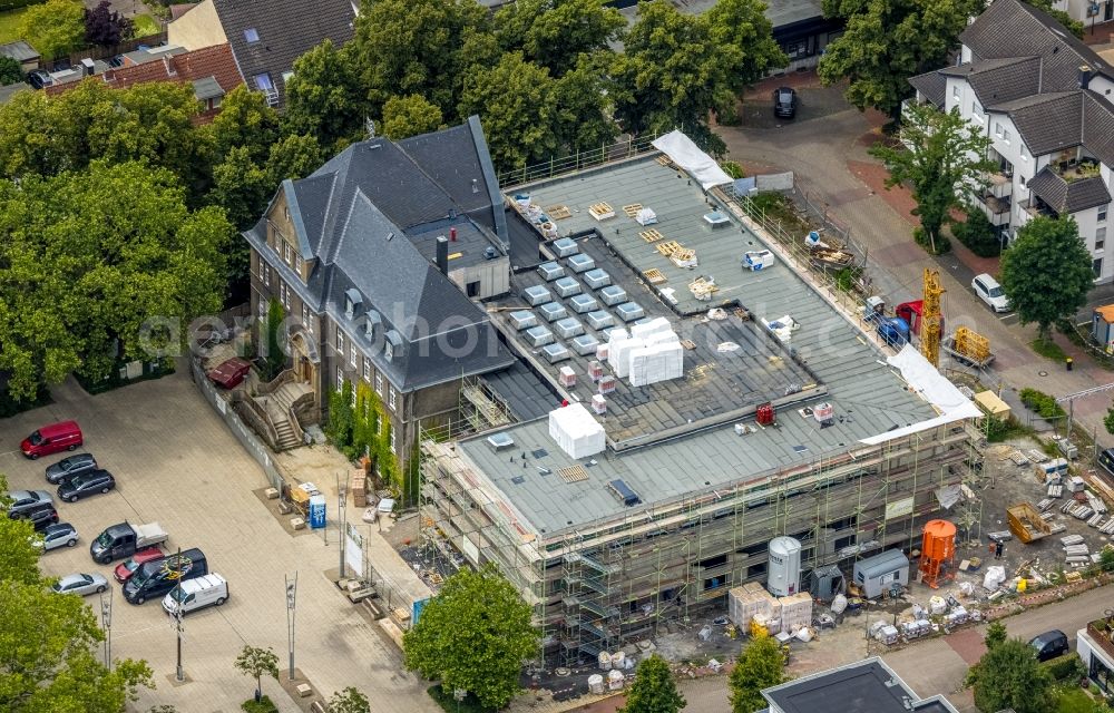 Aerial image Holzwickede - Construction site of Town Hall building of the city administration as a building extension Am Markt - Poststrasse in the district Brackel in Holzwickede at Ruhrgebiet in the state North Rhine-Westphalia, Germany