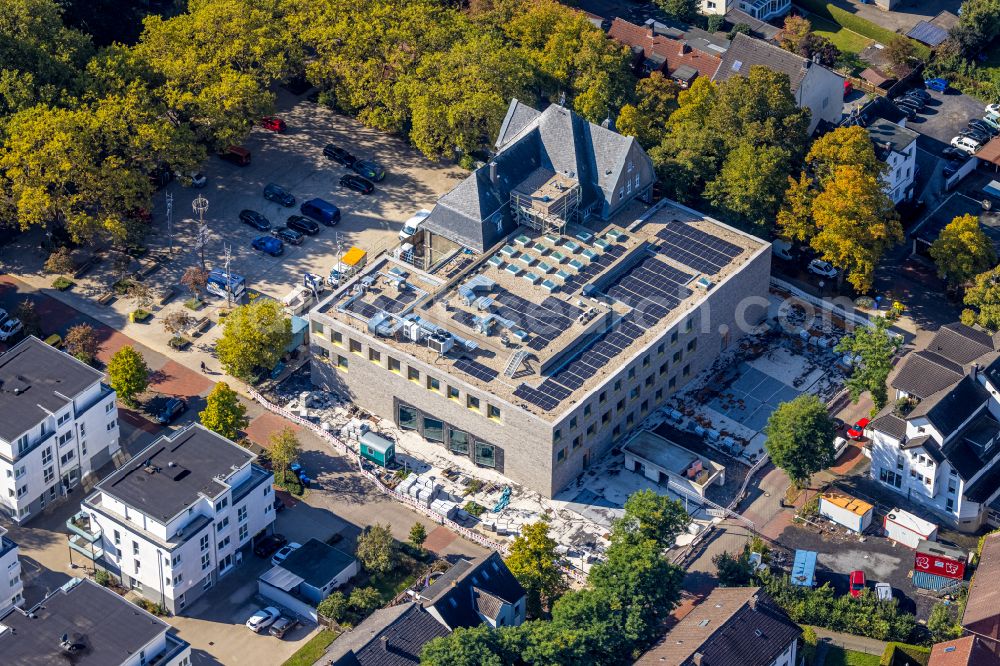 Holzwickede from the bird's eye view: Construction site of Town Hall building of the city administration as a building extension Am Markt - Poststrasse in the district Brackel in Holzwickede in the state North Rhine-Westphalia, Germany