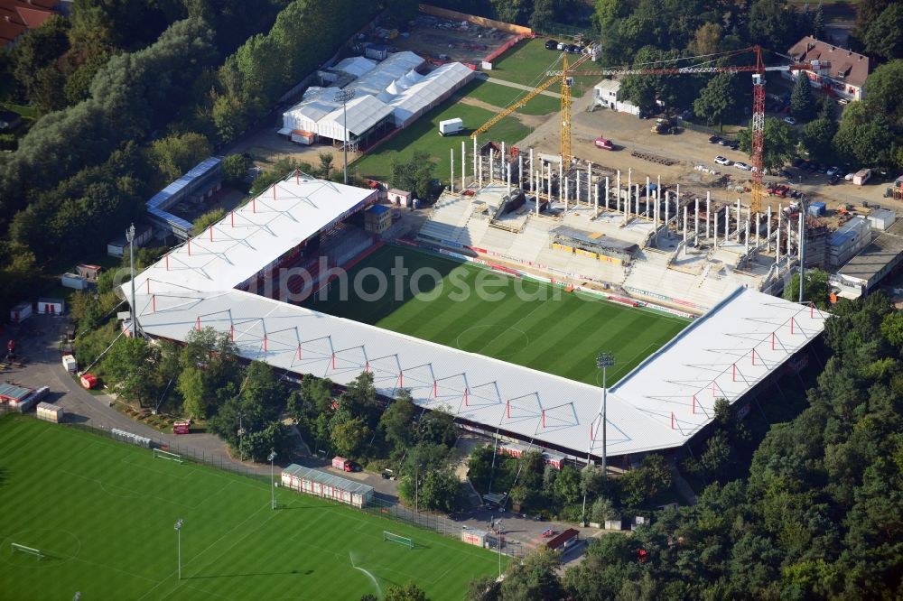 Aerial image Berlin - View at the new building of the main grandstand at the stadium At the old forester in the Wuhlheide in the Köpenick district of Berlin. Responsible for the construction is the brewer Baugesellschaft mbH & Co KG. The stadium is operated by at the old forester stadium operations AG