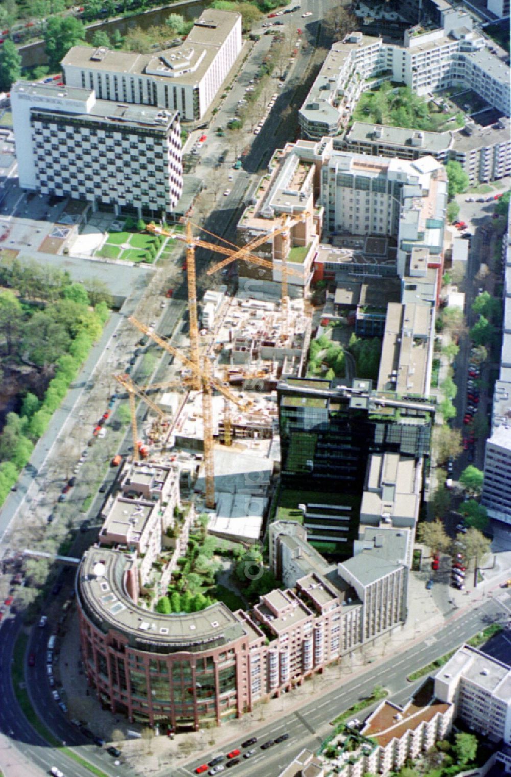 Aerial photograph Berlin - New construction high-rise construction site the hotel complex Pullman Berlin Schweizerhof on street Budapester Strasse in the district Tiergarten in Berlin, Germany