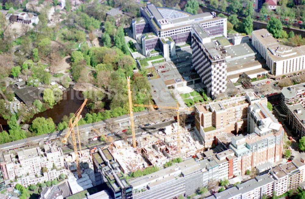 Aerial photograph Berlin - New construction high-rise construction site the hotel complex Pullman Berlin Schweizerhof on street Budapester Strasse in the district Tiergarten in Berlin, Germany