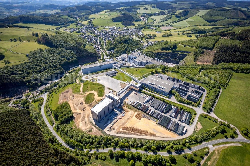 Grevenstein from the bird's eye view: Construction site and assembly work for the construction of a high-bay warehouse building complex and logistics center on the premises of the brewery Brauerei C.& A. VELTINS GmbH & Co. KG An of Streue in Grevenstein in the state North Rhine-Westphalia, Germany