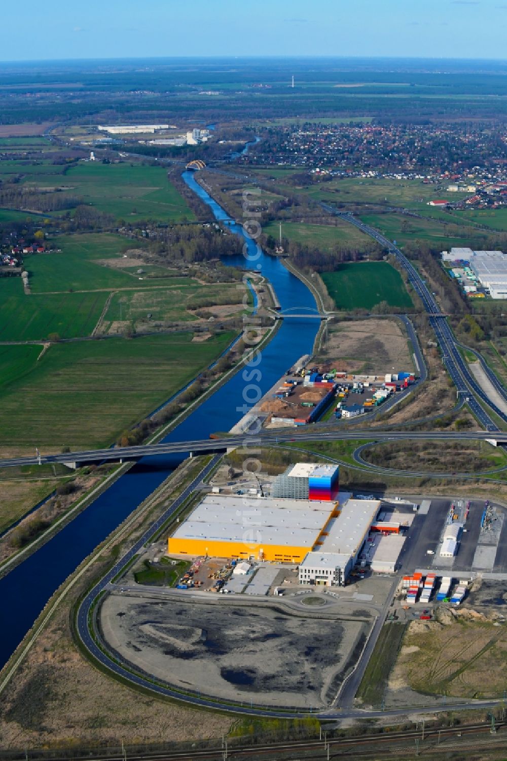 Aerial photograph Wustermark - Construction site and assembly work for the construction of a high-bay warehouse building complex and logistics center on the premises dm VZ Verteilerzentrum in Wustermark in the state Brandenburg, Germany