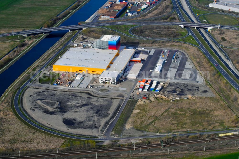 Wustermark from above - Construction site and assembly work for the construction of a high-bay warehouse building complex and logistics center on the premises dm VZ Verteilerzentrum in Wustermark in the state Brandenburg, Germany