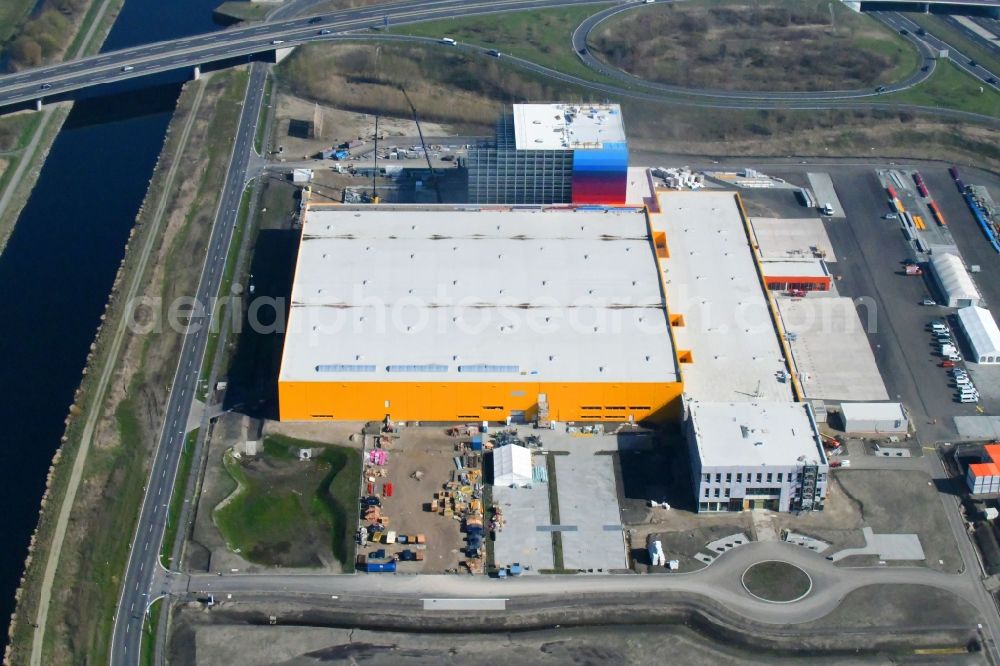 Aerial photograph Wustermark - Construction site and assembly work for the construction of a high-bay warehouse building complex and logistics center on the premises dm VZ Verteilerzentrum in Wustermark in the state Brandenburg, Germany