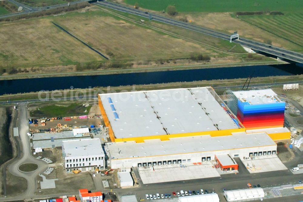 Aerial image Wustermark - Construction site and assembly work for the construction of a high-bay warehouse building complex and logistics center on the premises dm VZ Verteilerzentrum in Wustermark in the state Brandenburg, Germany