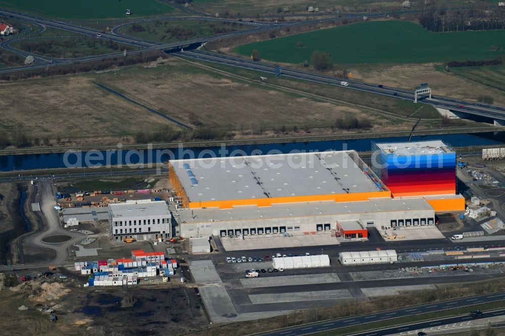 Aerial photograph Wustermark - Construction site and assembly work for the construction of a high-bay warehouse building complex and logistics center on the premises dm VZ Verteilerzentrum in Wustermark in the state Brandenburg, Germany