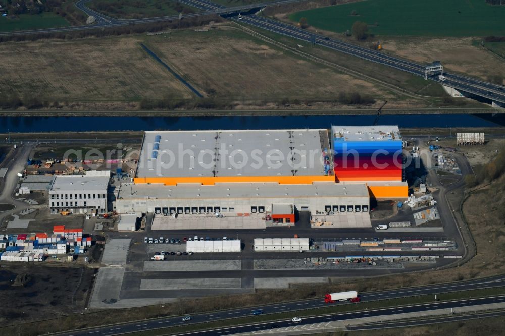 Wustermark from above - Construction site and assembly work for the construction of a high-bay warehouse building complex and logistics center on the premises dm VZ Verteilerzentrum in Wustermark in the state Brandenburg, Germany