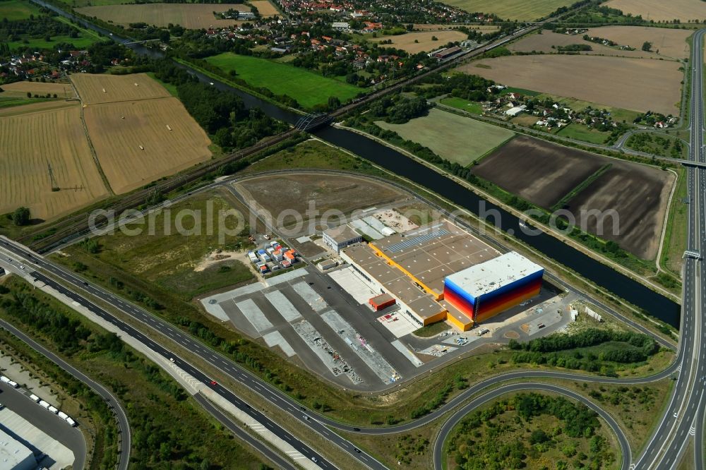 Aerial image Wustermark - Construction site and assembly work for the construction of a high-bay warehouse building complex and logistics center on the premises dm VZ Verteilerzentrum in Wustermark in the state Brandenburg, Germany